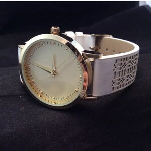 Elegant Gold-Tone Watch  White band with cutout design